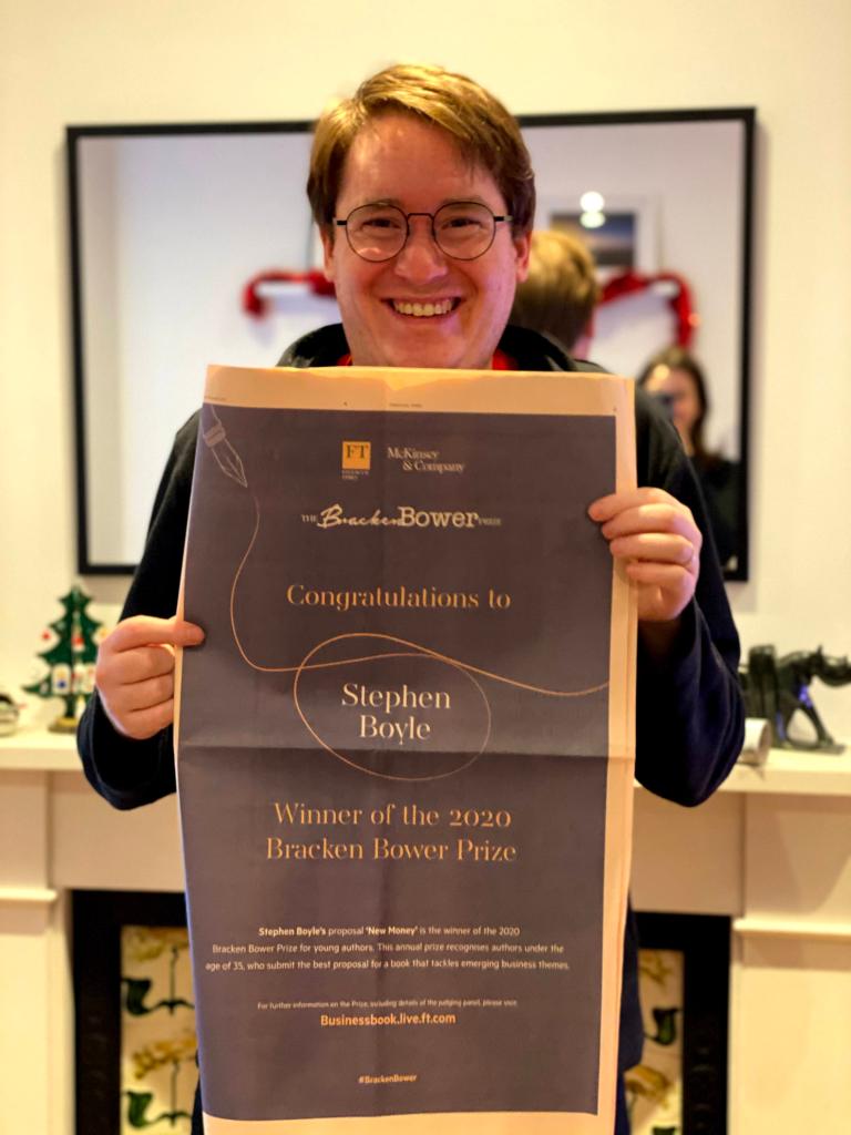 Holding the full page advertisement in the FT announcing I had won the Bracken Bower Prize